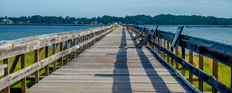 Long wooden walkway leading out to the bay